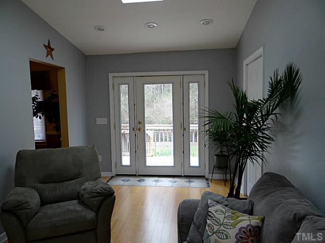432 Langdon Road Angier, NC 27501 - Photo 10 of 23 a living room with furniture and a potted plant