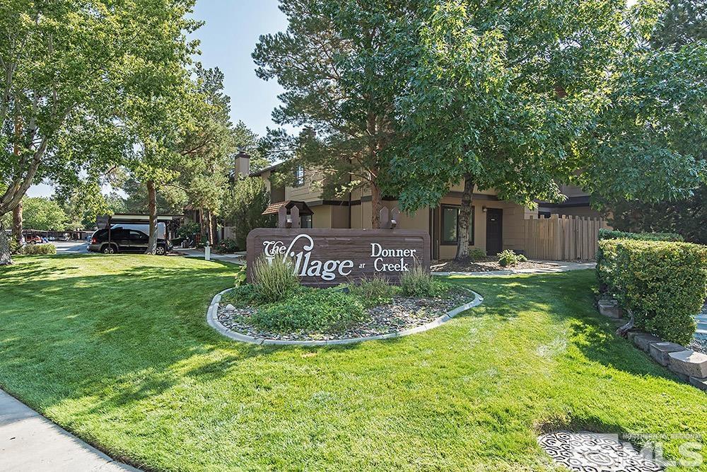4386 Matich Drive Reno, NV 89502 - Photo 20 of 20 a view of a backyard with table and chairs and wooden fence