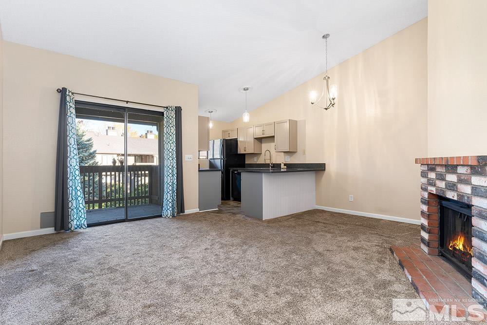 4386 Matich Drive Reno, NV 89502 - Photo 2 of 20 a view of a kitchen with a sink and a fireplace
