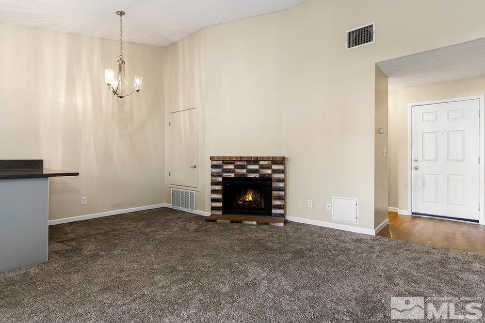 4386 Matich Drive Reno, NV 89502 - Photo 5 of 20 a view of an empty room with a cabinet