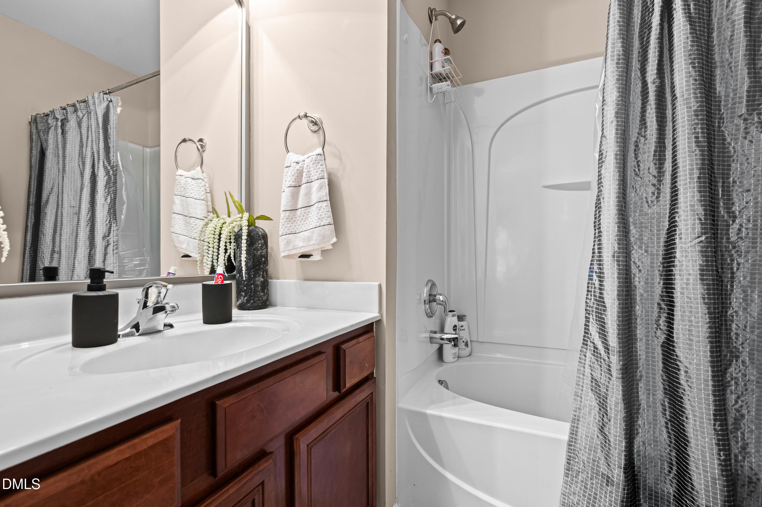 2944 Casona Way Raleigh, NC 27616 - Photo 19 of 24 a bathroom with a tub sink and mirror