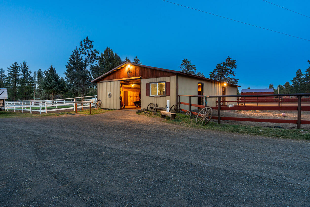 67500 Harrington Loop Road Bend, OR 97703 - Photo 35 of 72 a view of a house with backyard and trees