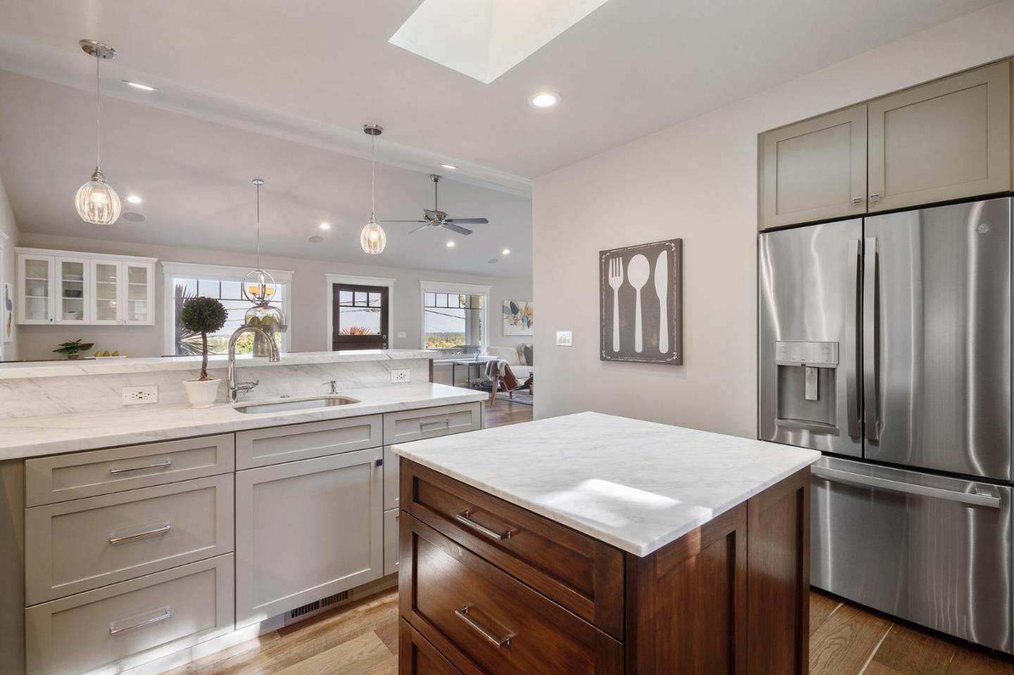 910 Sunset Drive San Carlos, CA 94070 - Photo 18 of 62 a kitchen with a refrigerator a sink and cabinets