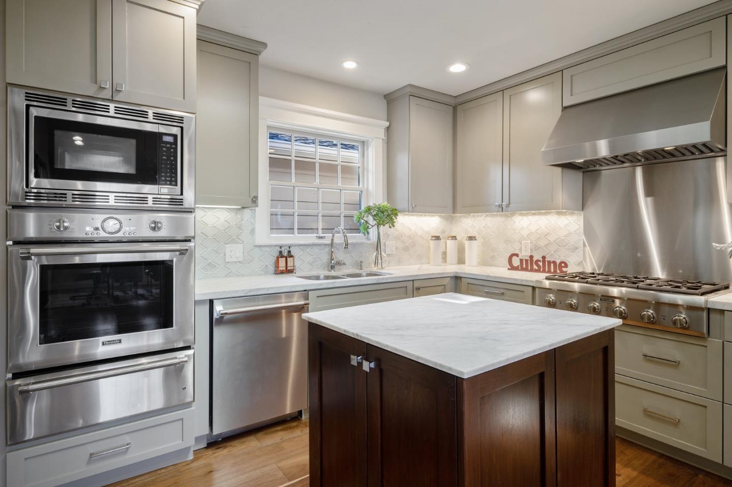 910 Sunset Drive San Carlos, CA 94070 - Photo 19 of 62 a kitchen with a stove and a microwave
