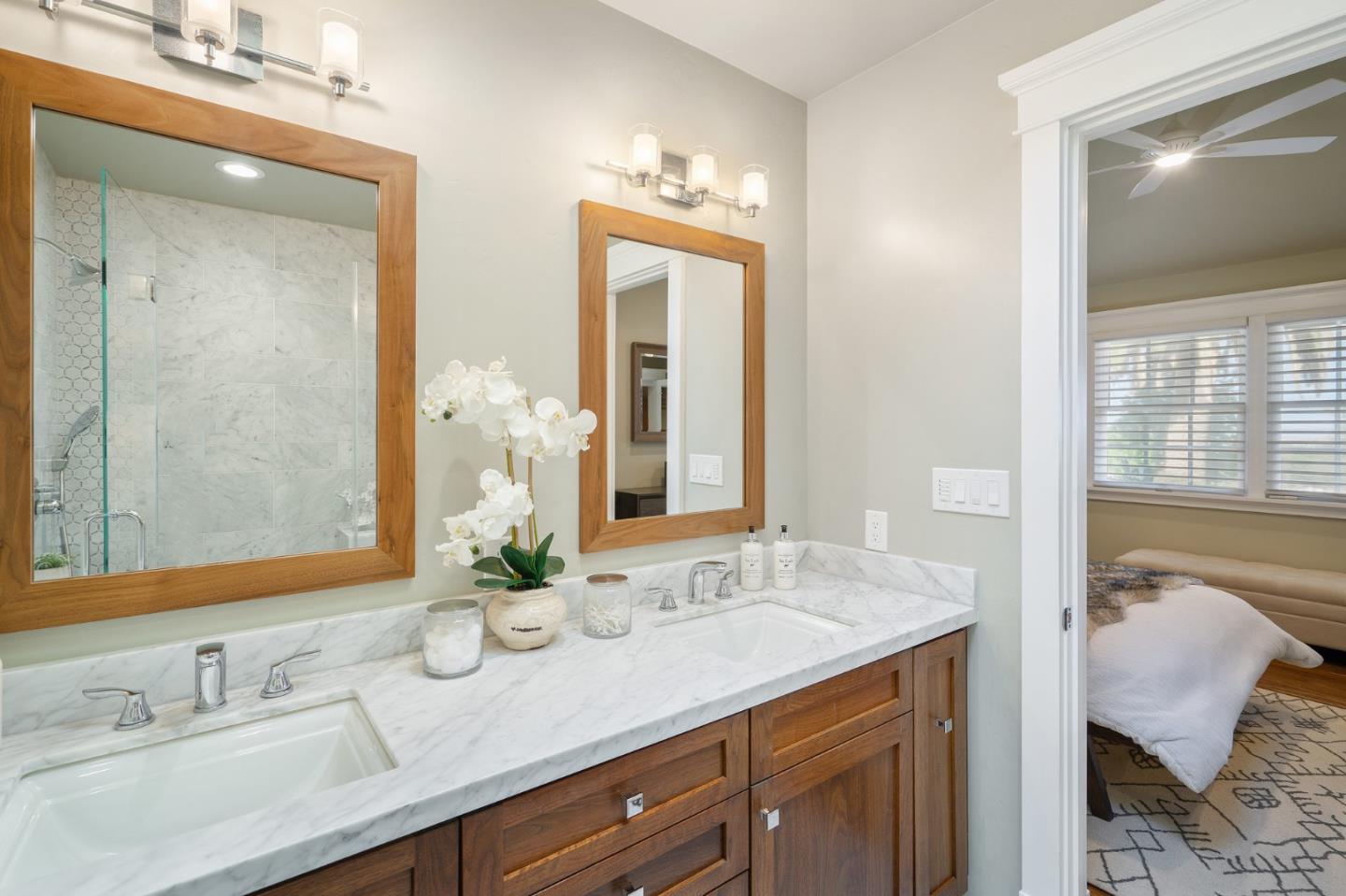 910 Sunset Drive San Carlos, CA 94070 - Photo 25 of 62 a bathroom with double vanity sinks and a mirror