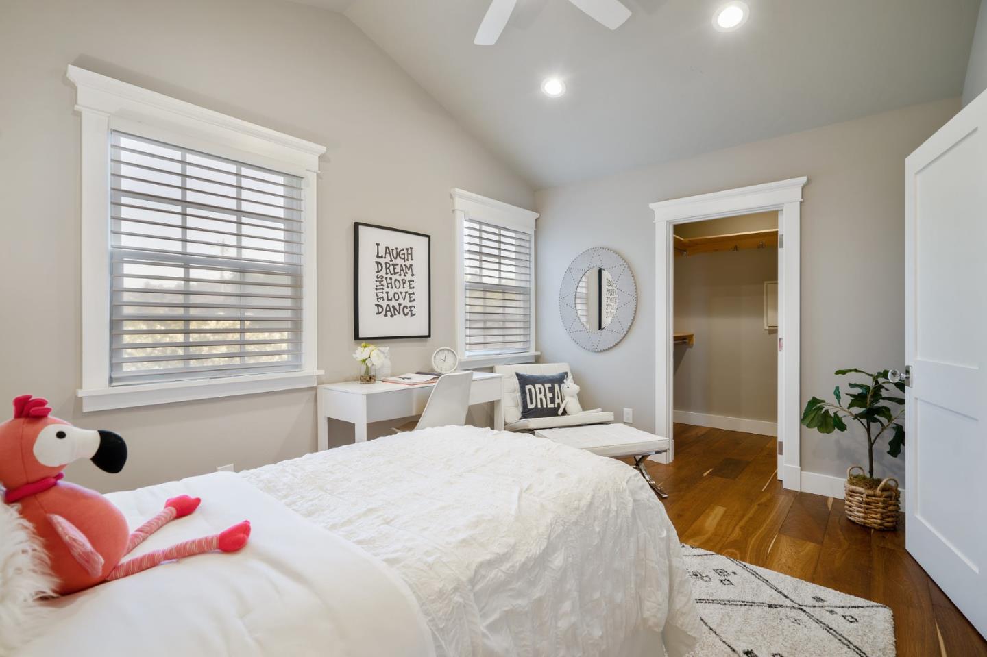 910 Sunset Drive San Carlos, CA 94070 - Photo 28 of 62 a bedroom with a bed a potted plant and dresser with wooden floor