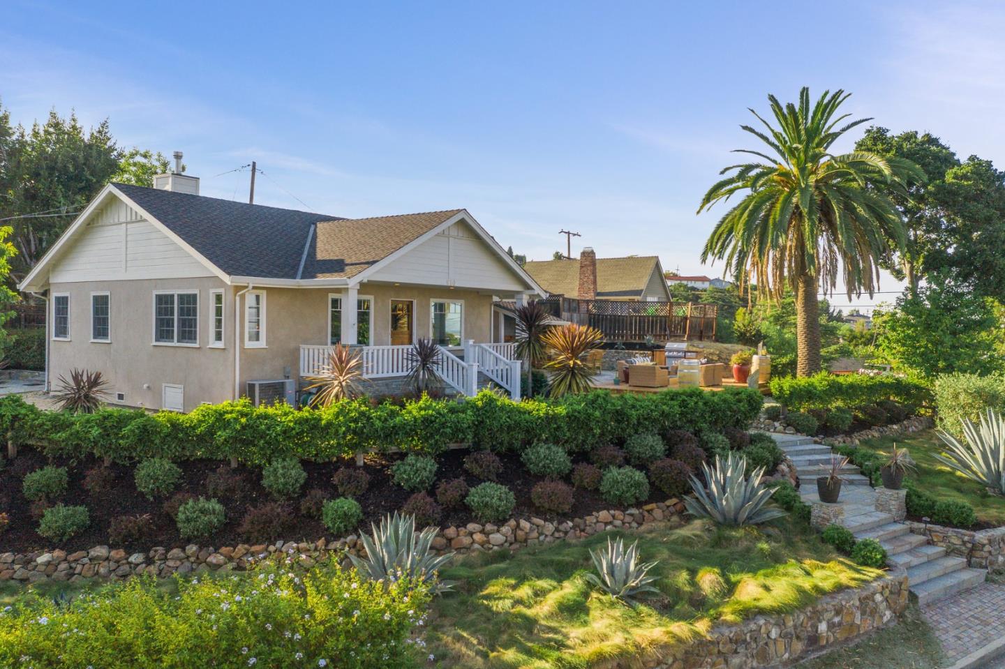 910 Sunset Drive San Carlos, CA 94070 - Photo 3 of 62 a front view of a house with a garden