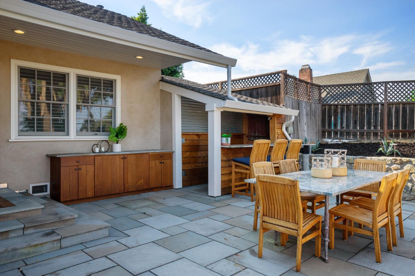 910 Sunset Drive San Carlos, CA 94070 - Photo 34 of 62 a view of a dinning table and chairs in the patio
