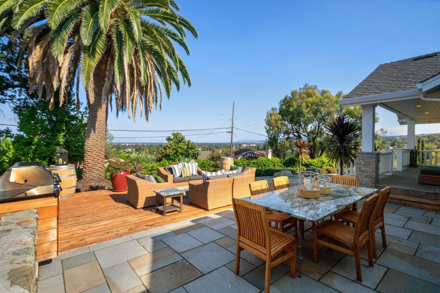 910 Sunset Drive San Carlos, CA 94070 - Photo 35 of 62 a backyard of a house with barbeque oven table and chairs