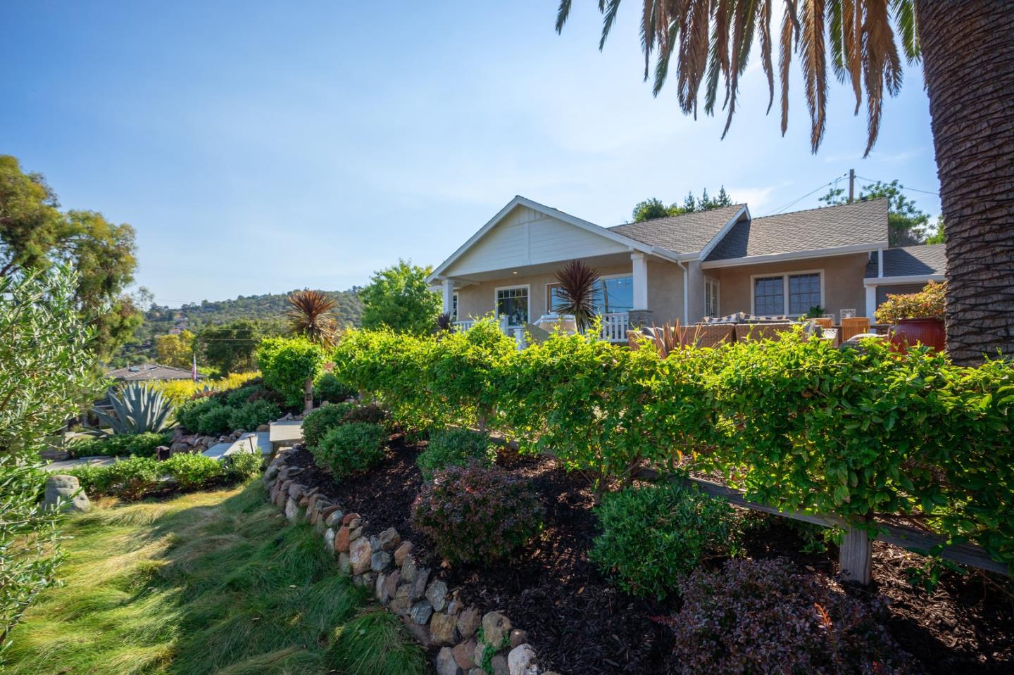 910 Sunset Drive San Carlos, CA 94070 - Photo 38 of 62 a front view of a house with a garden