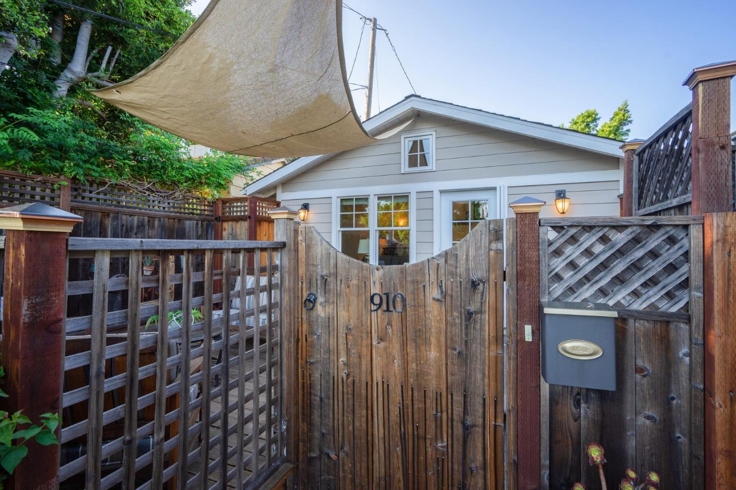 910 Sunset Drive San Carlos, CA 94070 - Photo 40 of 62 a view of a house with a small yard and wooden fence