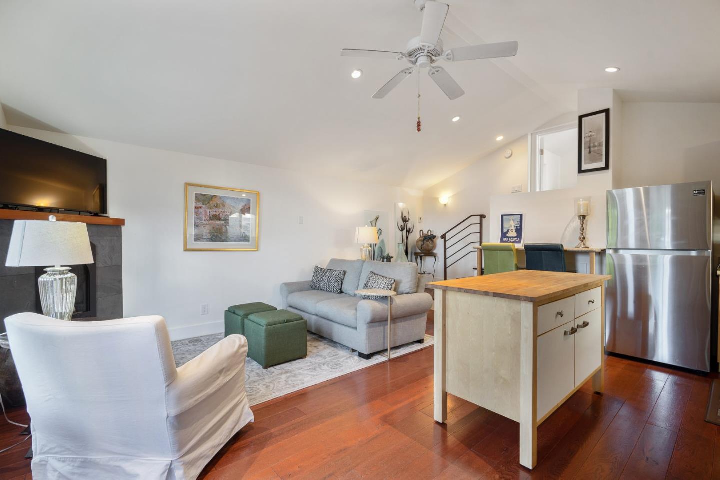 910 Sunset Drive San Carlos, CA 94070 - Photo 43 of 62 a living room with furniture a flat screen tv and a refrigerator