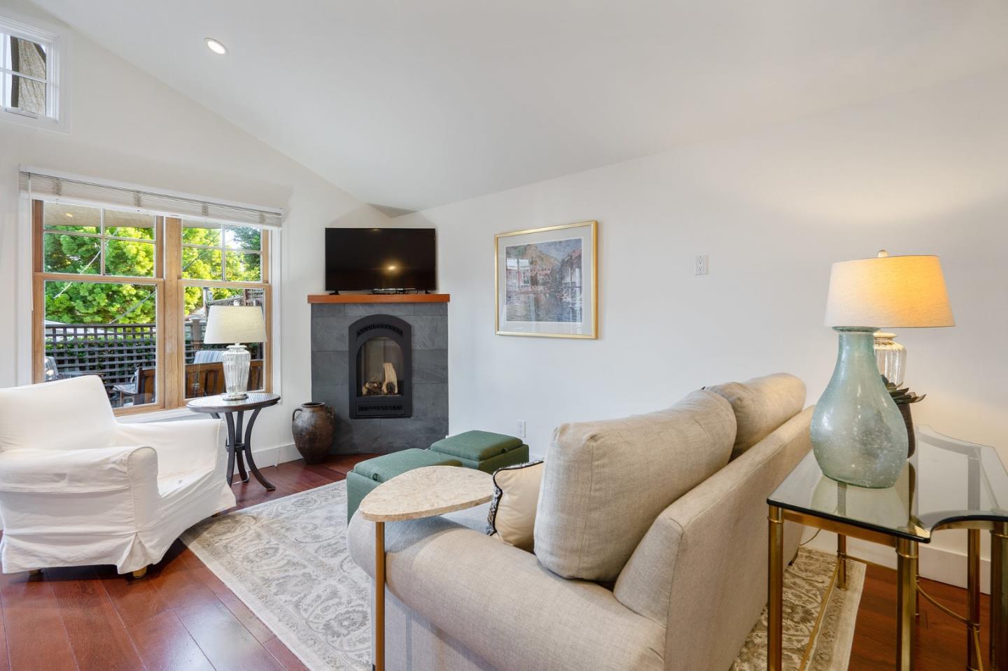 910 Sunset Drive San Carlos, CA 94070 - Photo 44 of 62 a living room with furniture a fireplace and a flat screen tv
