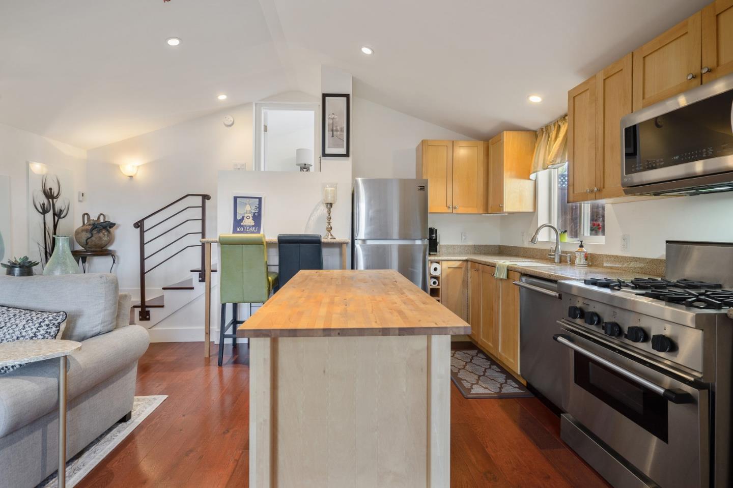 910 Sunset Drive San Carlos, CA 94070 - Photo 46 of 62 a kitchen with stainless steel appliances a stove a sink a microwave a refrigerator a stove and white cabinets
