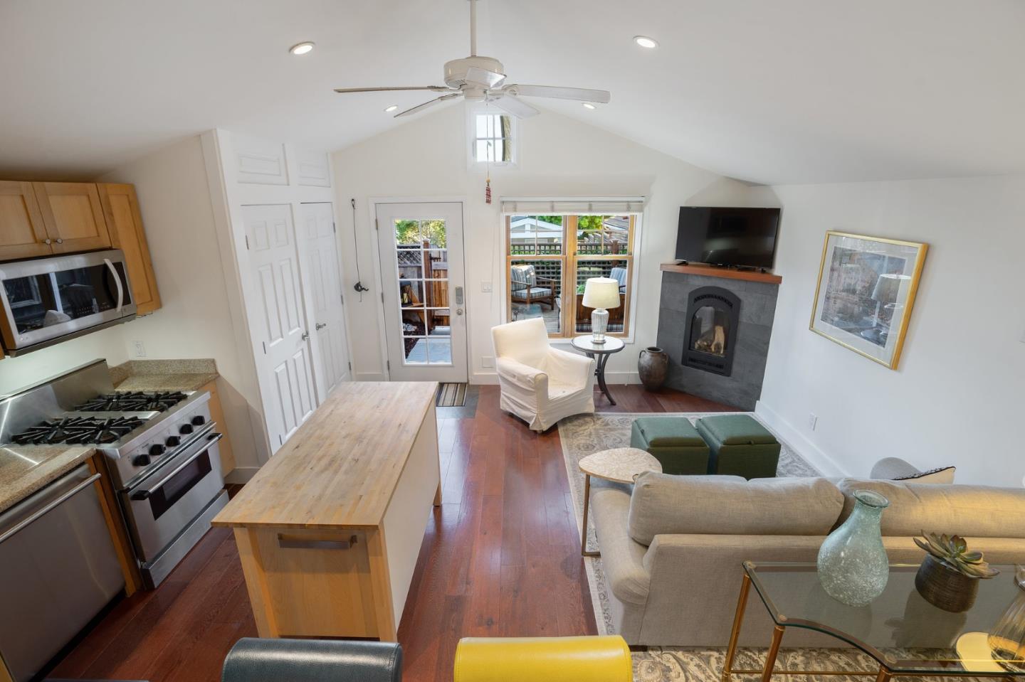 910 Sunset Drive San Carlos, CA 94070 - Photo 48 of 62 a living room with furniture a fireplace and a flat screen tv