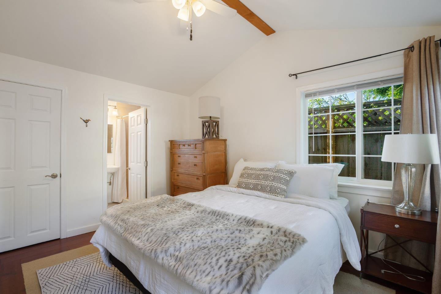 910 Sunset Drive San Carlos, CA 94070 - Photo 50 of 62 a bedroom with a bed and a window