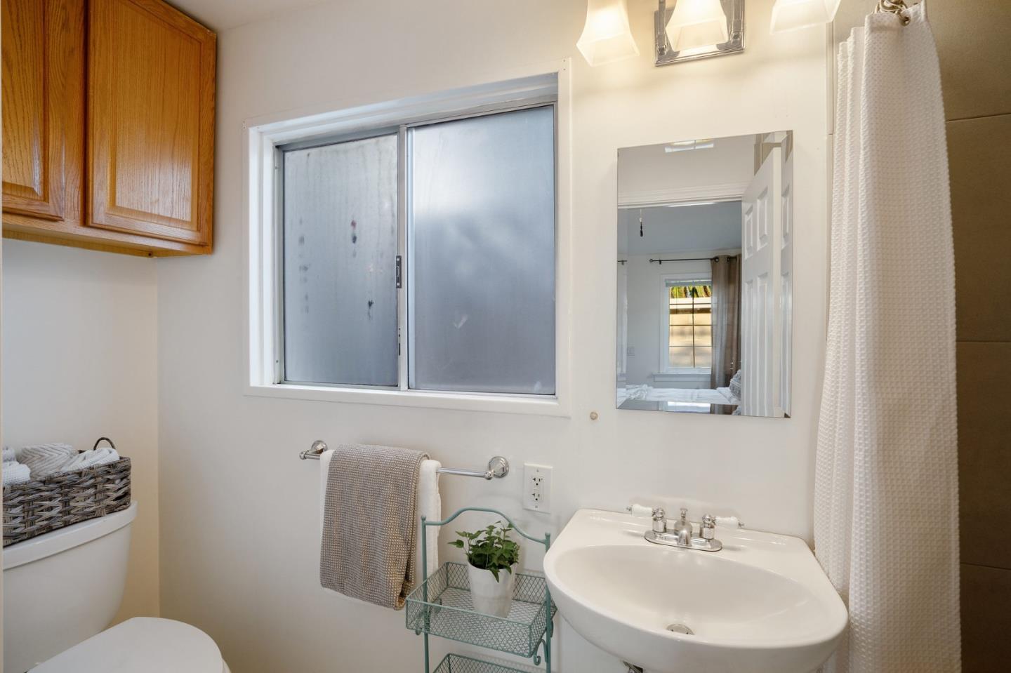 910 Sunset Drive San Carlos, CA 94070 - Photo 51 of 62 a bathroom with a sink mirror and toilet