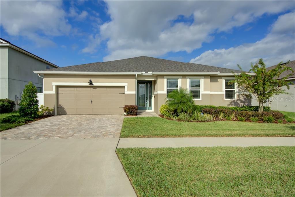 12313 Prairie Valley Lane Riverview, FL 33579 - Photo 1 of 1 a front view of a house with a yard and garage