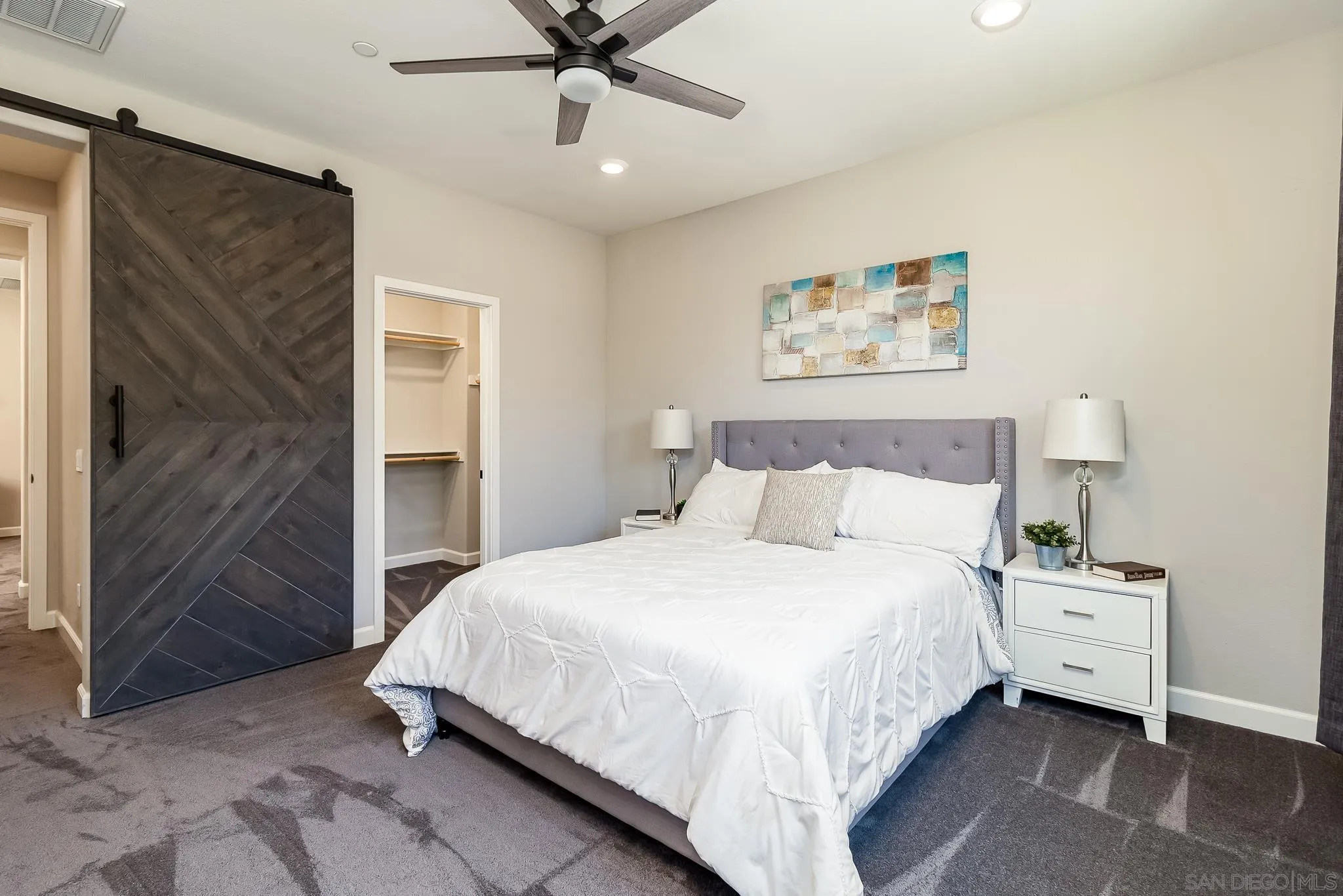 1094 Delpy View Point Vista, CA 92084 - Photo 14 of 43 a bedroom with a bed and a painting on the wall