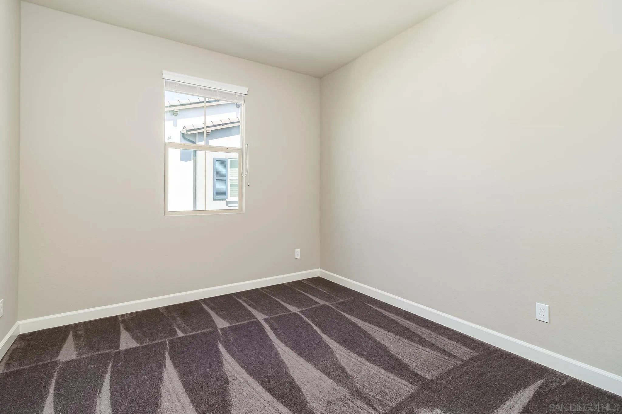 1094 Delpy View Point Vista, CA 92084 - Photo 18 of 43 an empty room with a window