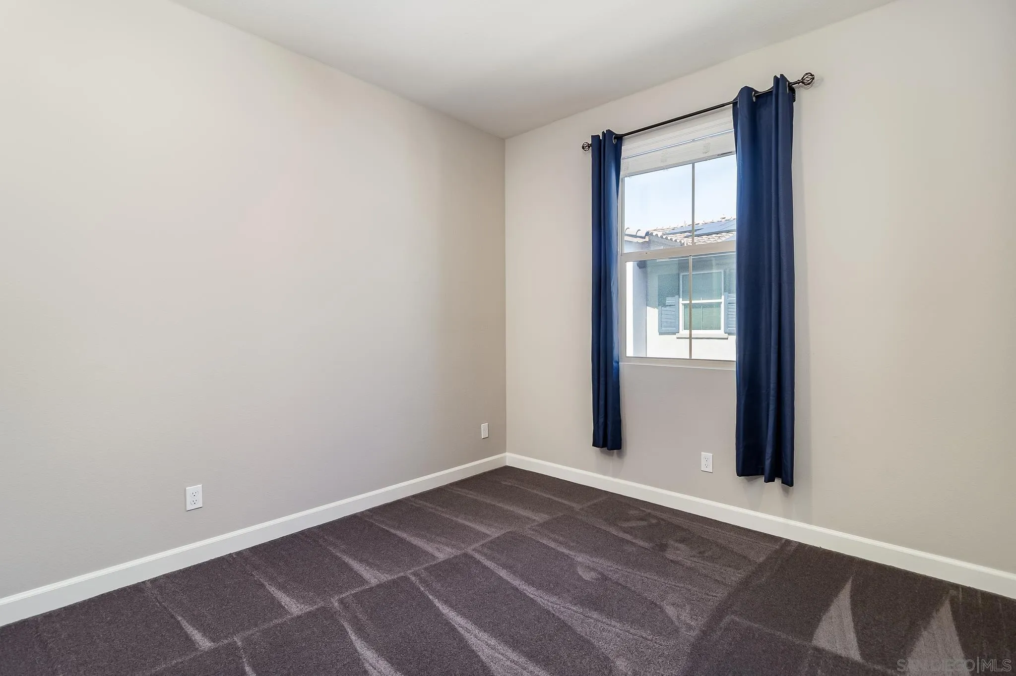1094 Delpy View Point Vista, CA 92084 - Photo 20 of 43 an empty room with windows and closet