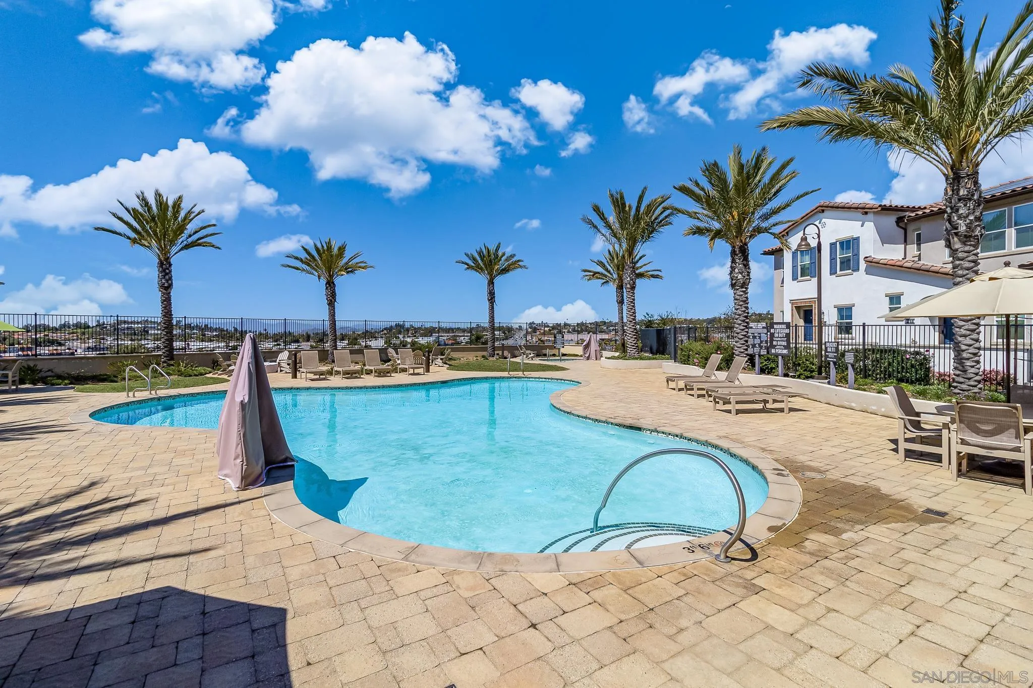 1094 Delpy View Point Vista, CA 92084 - Photo 31 of 43 a view of a swimming pool with a lounge chair