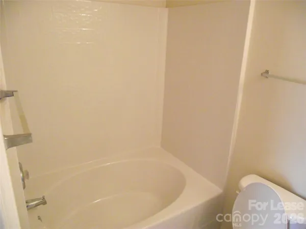 a close up of a bathtub in a bathroom