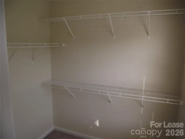 a view of a room with racks on the wall