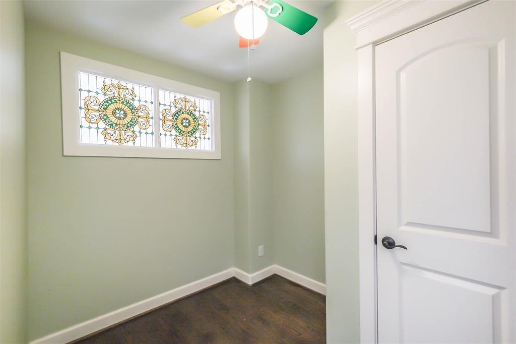 706 Allston Street, Unit B Houston, TX 77007 - Photo 23 of 33 an empty room with wooden floor closet and windows
