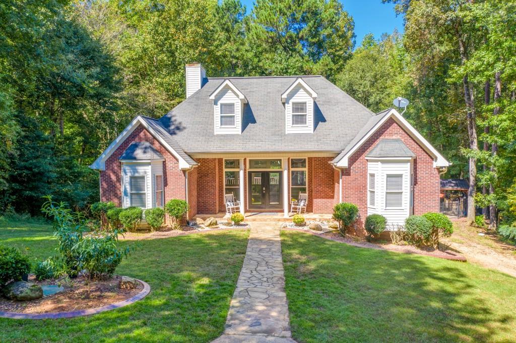 4020 Jonesboro Road Hampton, GA 30228 - Photo 1 of 1 front view of a house with a yard