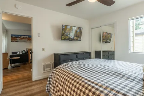 a bedroom with a bed and a view of bedroom