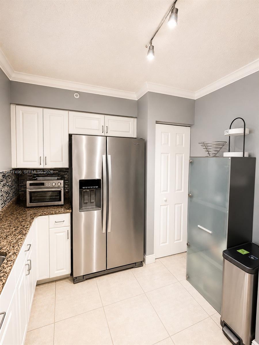 Brickell Miami, FL 33131 - Photo 7 of 19 a kitchen with stainless steel appliances a refrigerator and a stove top oven