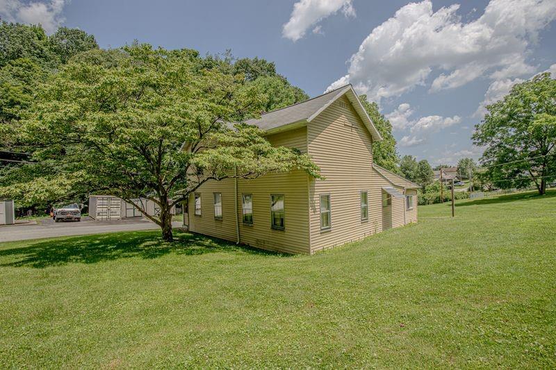 810 Pleasant View Smock Road Smock, PA 15480 - Photo 11 of 12 a view of a house with a yard