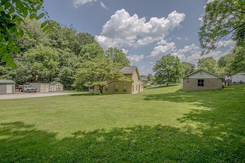 810 Pleasant View Smock Road Smock, PA 15480 - Photo 12 of 12 a front view of a house with garden
