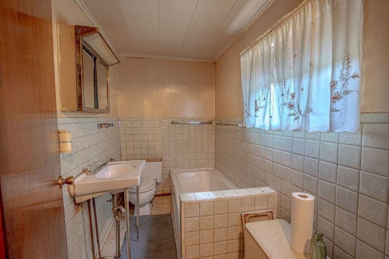 810 Pleasant View Smock Road Smock, PA 15480 - Photo 7 of 12 a bathroom with a sink a toilet and shower