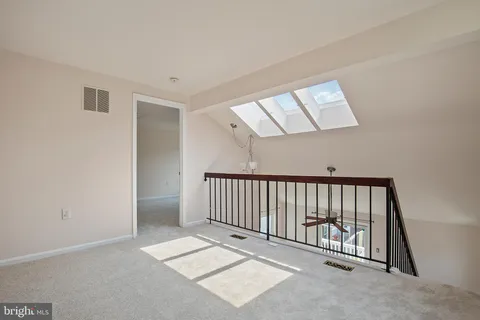 a view of a hallway with windows