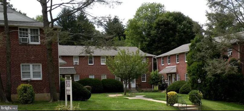 20 B St Albans Avenue Newtown Square, PA 19073 - Photo 2 of 13 a front view of a house with a yard