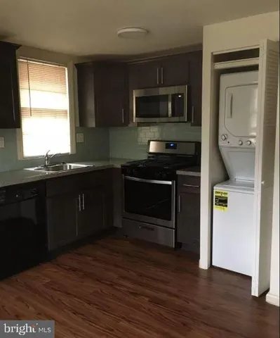 a kitchen with a sink and a stove