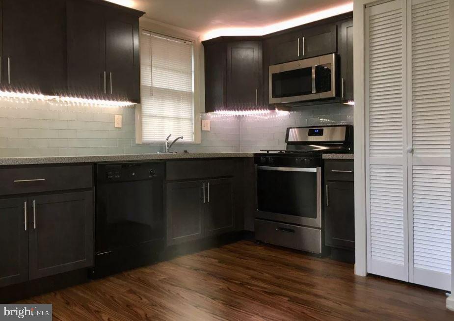 20 B St Albans Avenue Newtown Square, PA 19073 - Photo 10 of 13 a kitchen with appliances a sink and cabinets