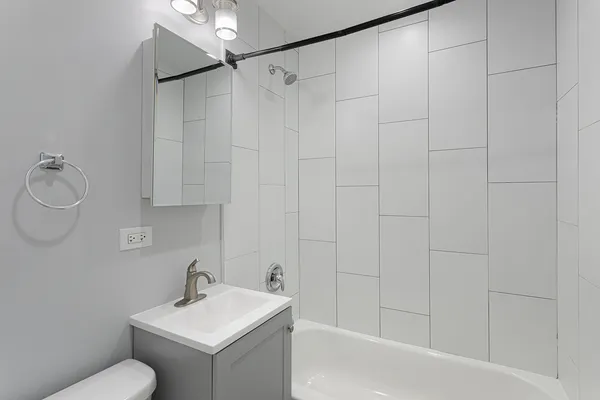 a bathroom with a sink toilet and vanity