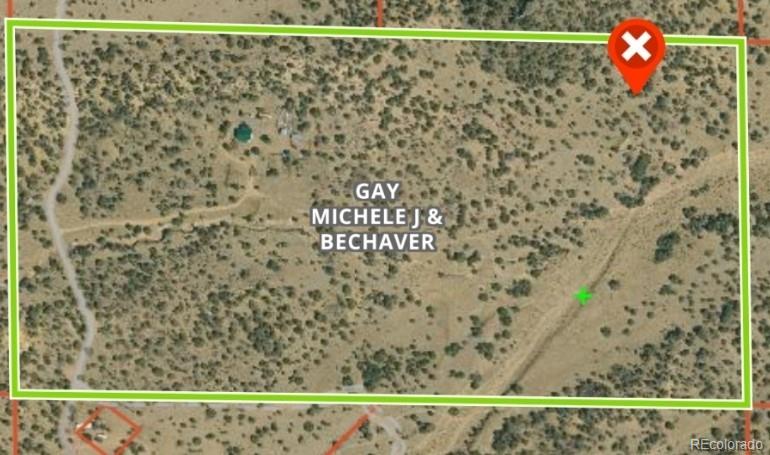 952 Twin Lakes Road Walsenburg, CO 81089 - Photo 11 of 47 a bathroom with a shower curtain and a sink