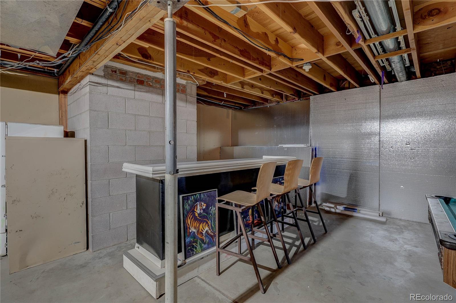 952 Twin Lakes Road Walsenburg, CO 81089 - Photo 17 of 47 a view of a room with chairs and table
