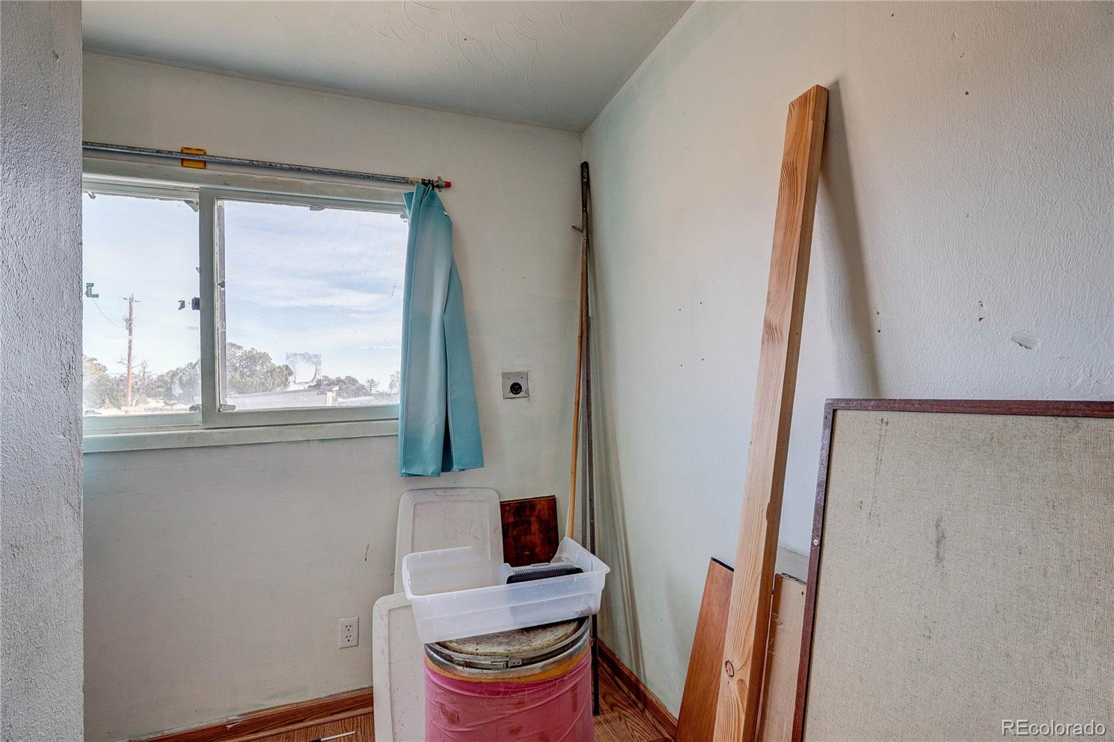 952 Twin Lakes Road Walsenburg, CO 81089 - Photo 18 of 47 a view of a kitchen with wooden floor and furniture