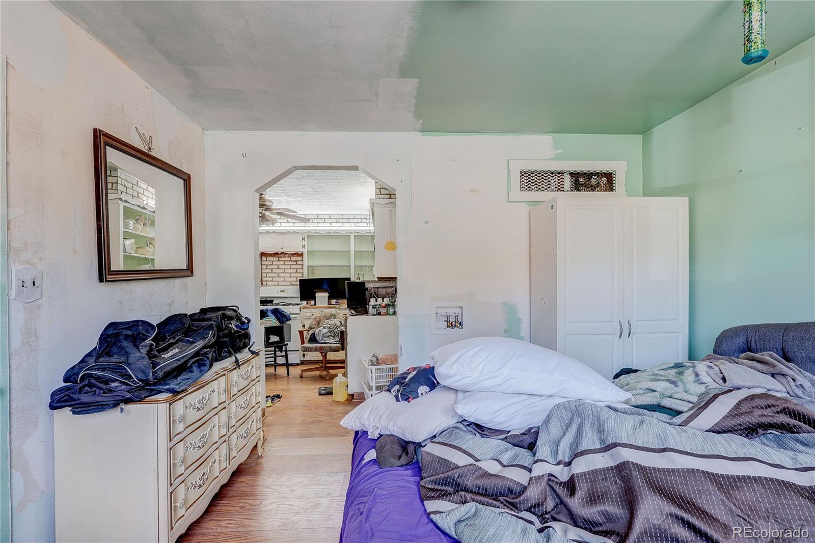 952 Twin Lakes Road Walsenburg, CO 81089 - Photo 21 of 47 a bedroom with furniture a bed and a dresser