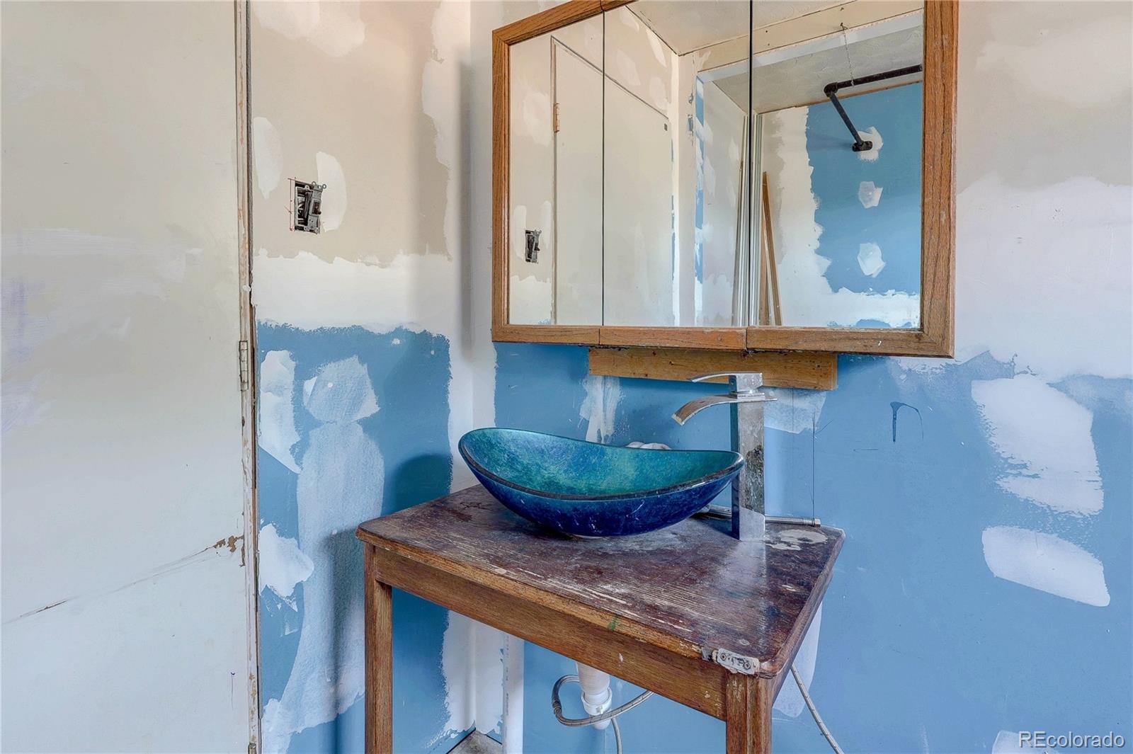 952 Twin Lakes Road Walsenburg, CO 81089 - Photo 29 of 47 a bathroom with a sink and a mirror