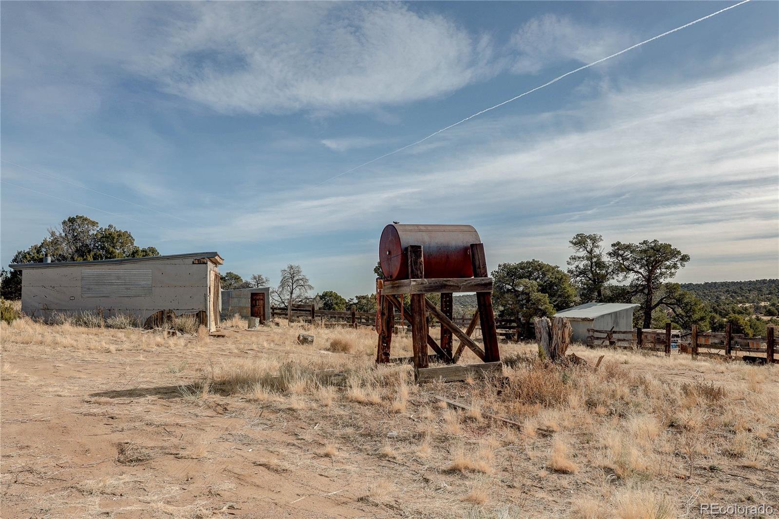 952 Twin Lakes Road Walsenburg, CO 81089 - Photo 45 of 47 a room with furniture and a flat screen tv