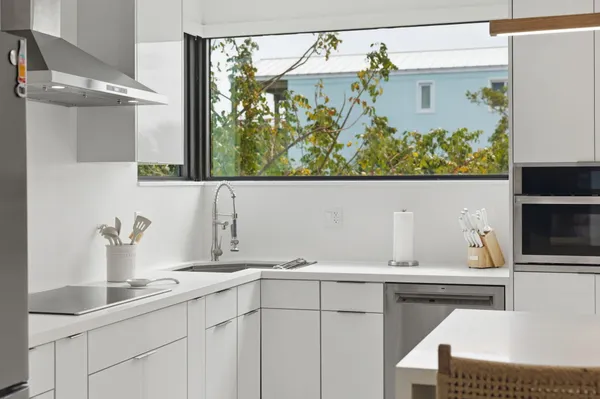 a kitchen with stainless steel appliances a refrigerator and a sink