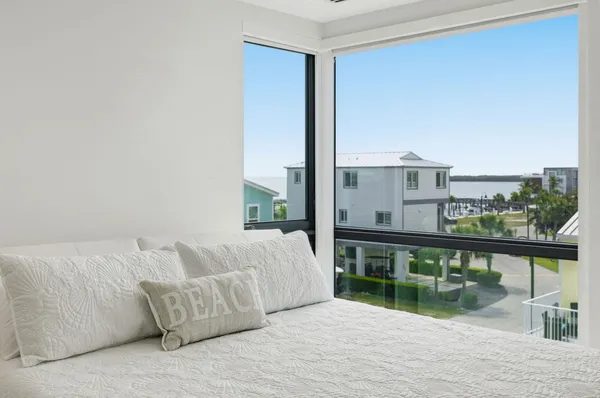 a bathroom with a granite countertop toilet sink and mirror