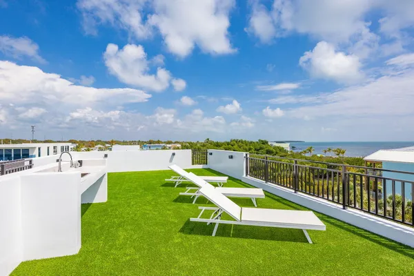 an aerial view of a house with a swimming pool