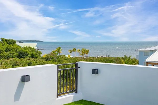 a view of yard from terrace with seating space